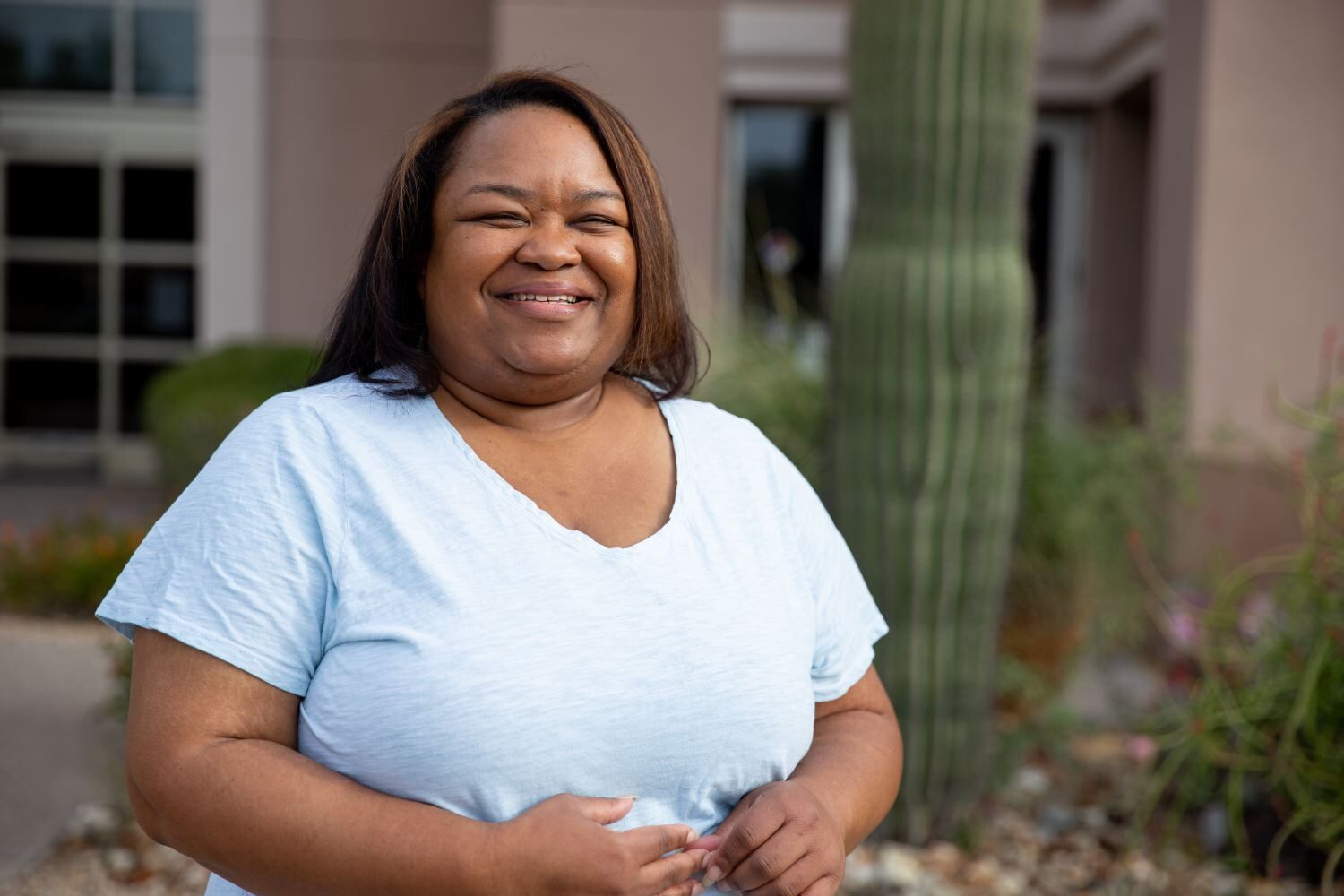 Woman smiling outside of Great Smiles Dental Care